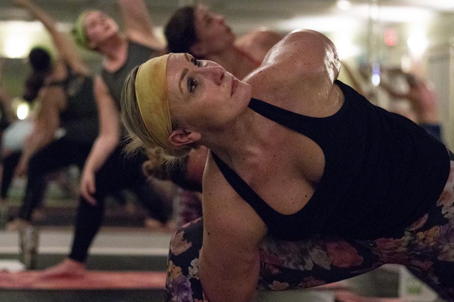 Kelly Rice practices advanced yoga poses during the Hot Yoga Traditional/ Blend class on Jan. 23, 2019. This class welcomes all levels of yoga including beginners.
