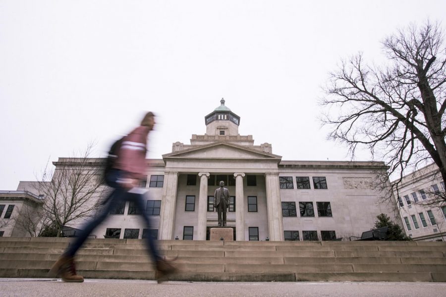 A student walks in front of Cherry Hall on Feb. 22.