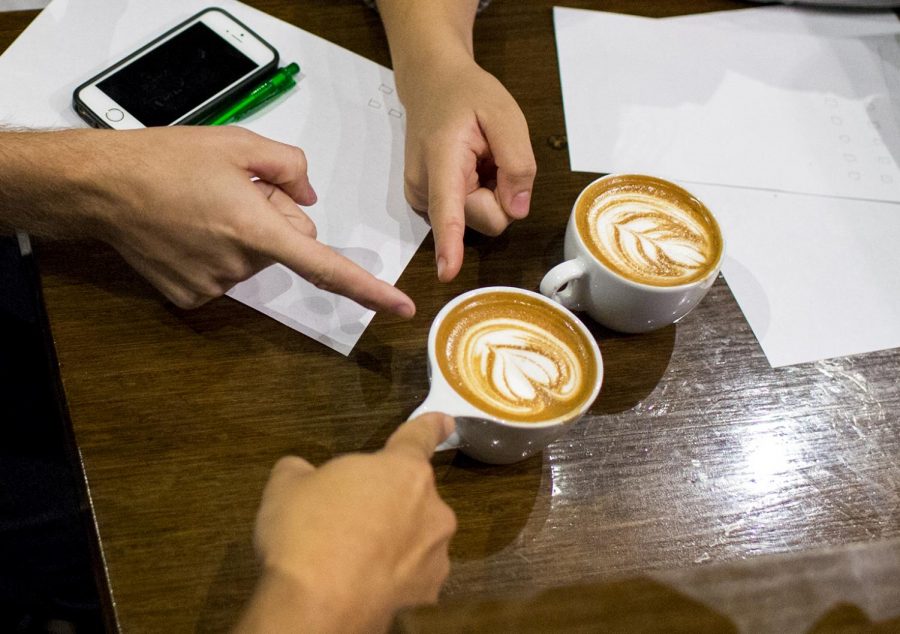 During the fifth annual Ky-Tn Latte Art Throwdown, judges decide which contestant's latte art will go to the next round in the competition. The lattes were judged based on the difficulty of pour, contrast, symmetry, aesthetic beauty and color infusion. The event was held on Thursday at Spencer's Coffee.