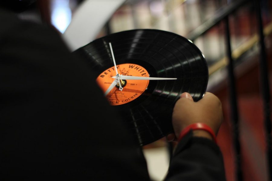 Visitors to the "Market on the Anevue" information fair could learn about "upcycling" by making clocks out of old vinyl albums. Upcycling involves creating new, more usable items out of old, underused items.