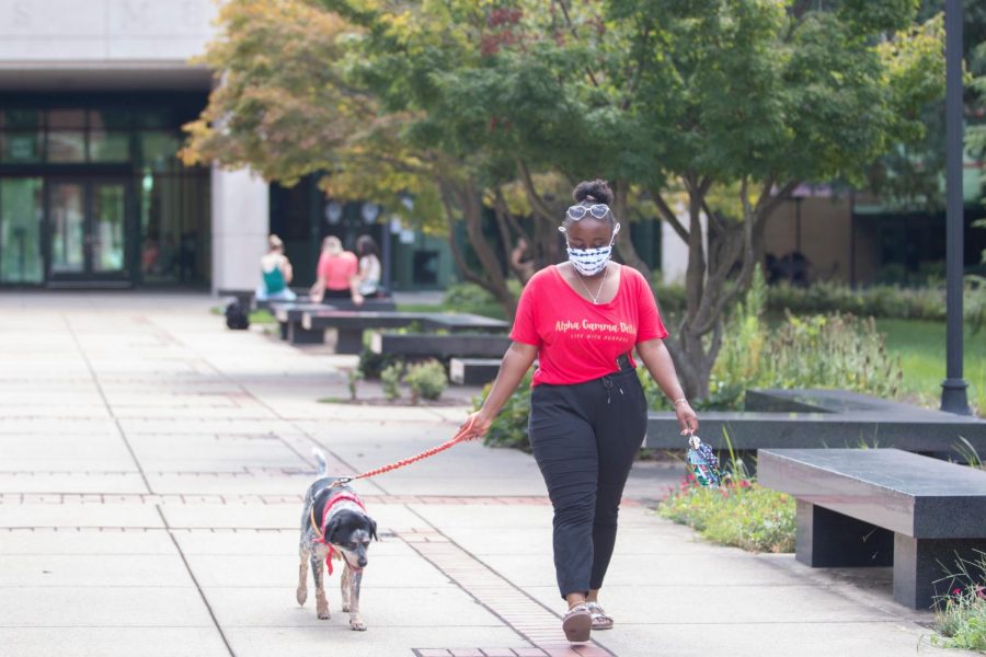 Jalissa Novotney, a senior anthropology major from Chicago and her emotional support animal Hazel Grace outside of Jody Richards Hall on Aug. 25, 2020.