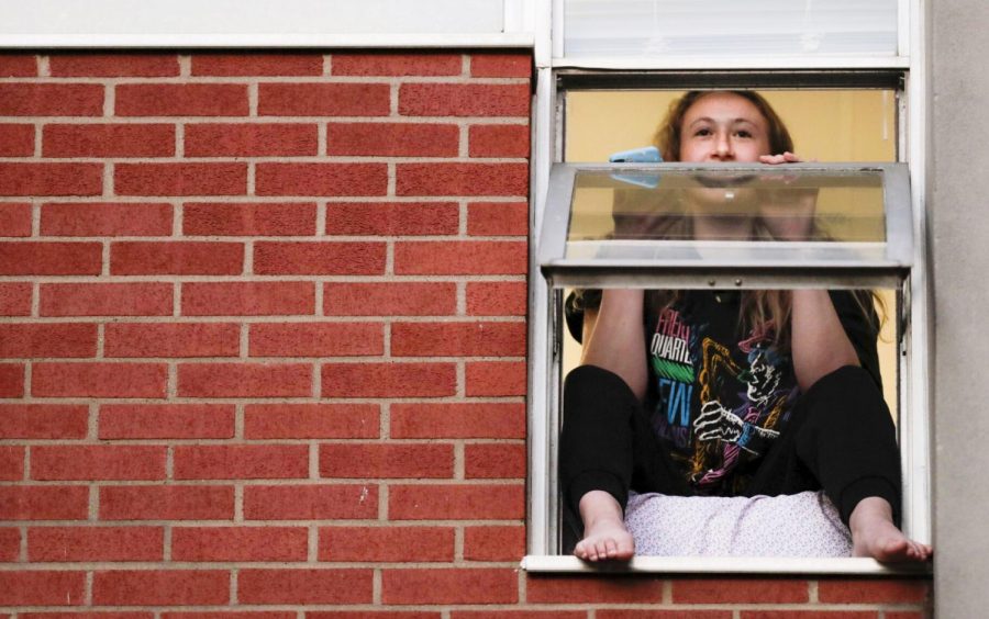 Kate Segrest sits in the windowsill