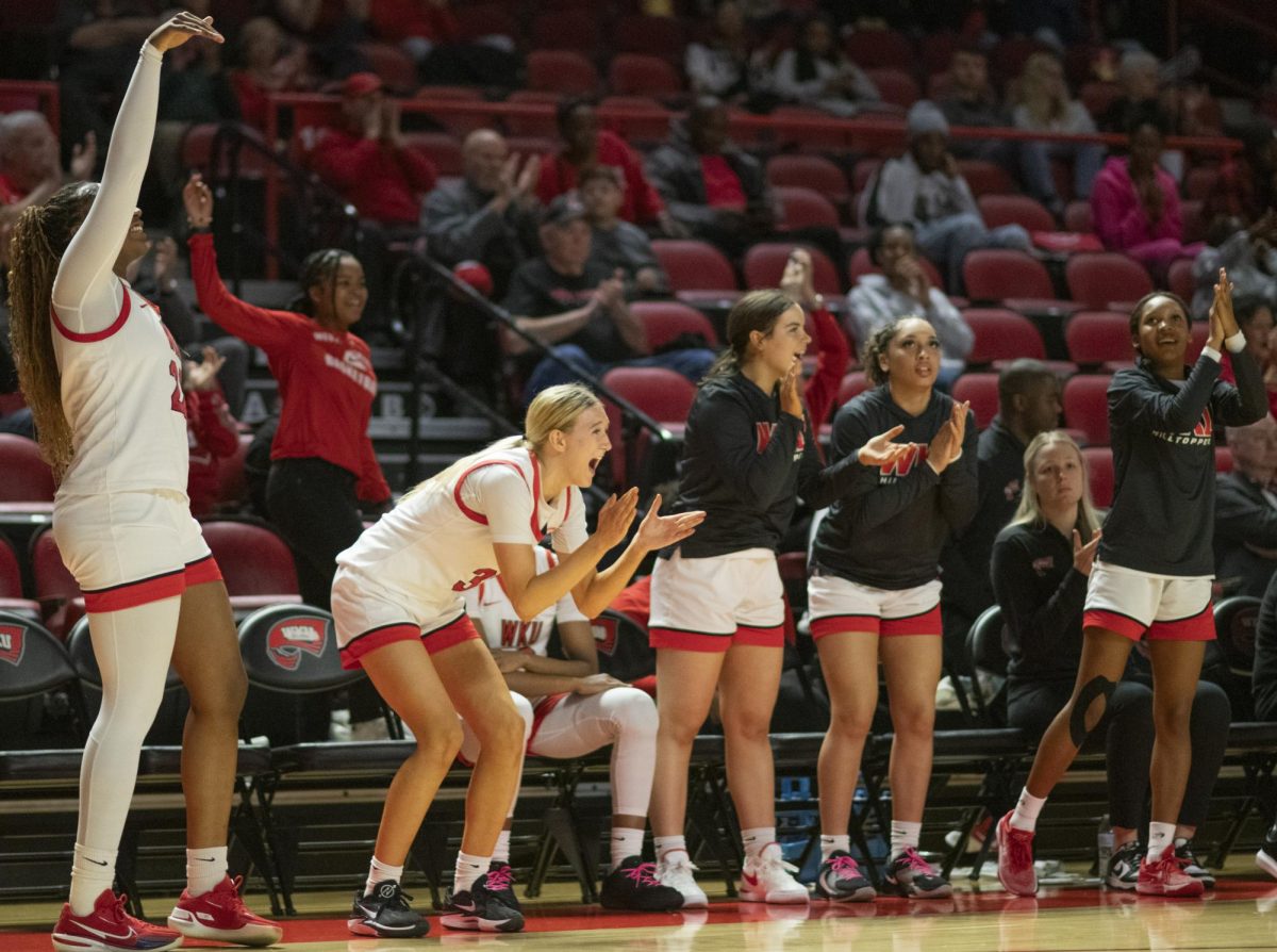  The WKU Lady Toppers celebrate a 3-point field goal by Teresa Faustino during Western Kentucky University's game against Liberty University on Saturday, March 9, 2024. 