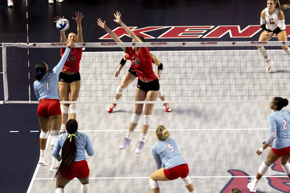 Right side hitter Kenadee Coyle (33) attempts to block an attack from Louisiana Tech’s Izabely Benjamin (1) during WKU’s 3-0 sweep of LA Tech on Saturday, Oct. 19, 2024 in Diddle Arena. Western won all 6 sets between two games against LA Tech this weekend. 