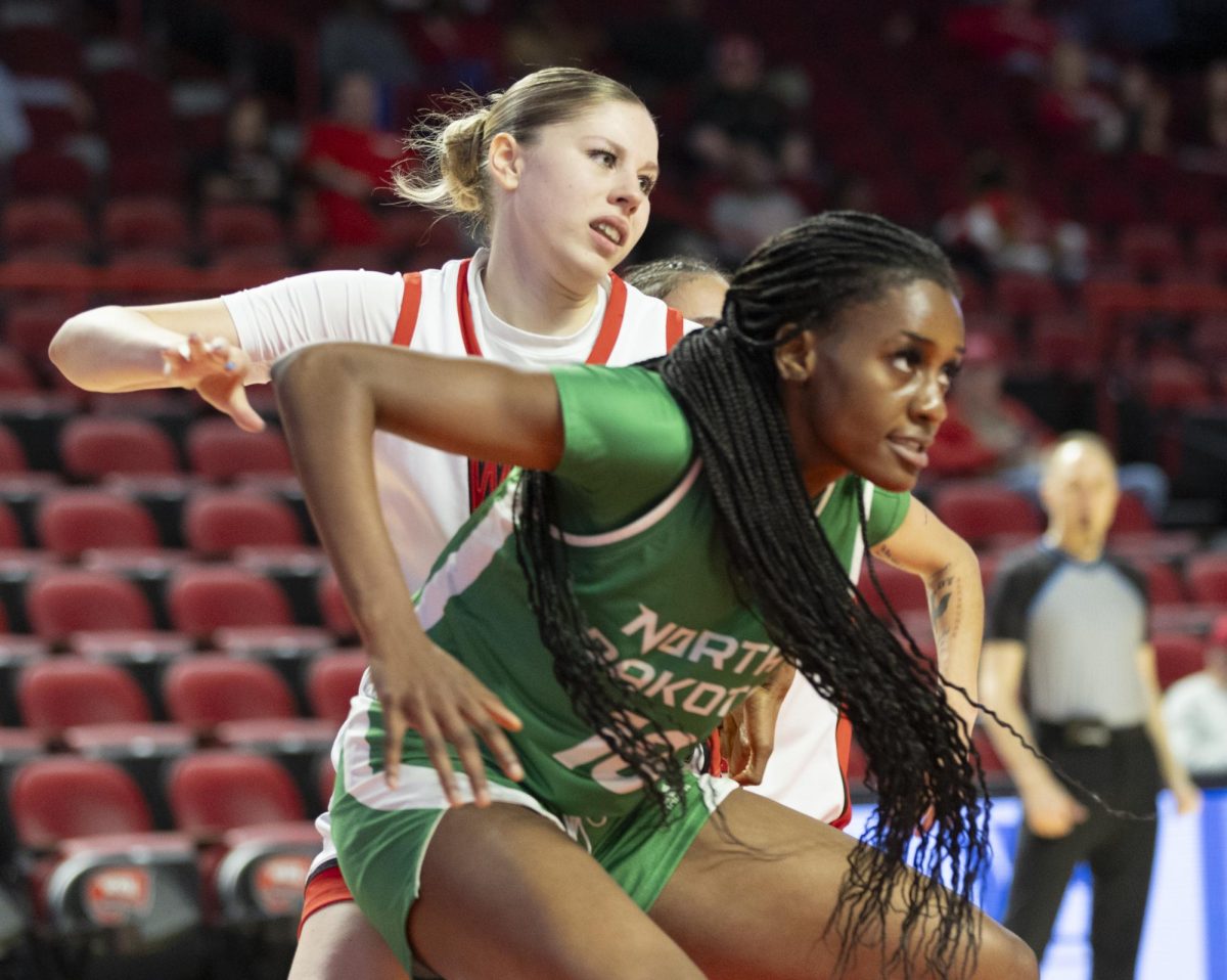 Western forward Zsofia Telegdy (23) guards Fighting Hawks center Fatima Ibrahim (10) during WKU’s match against North Dakota on Sunday, Nov. 24, 2024 at E.A. Diddle Arena. The Lady Toppers won 74-69.