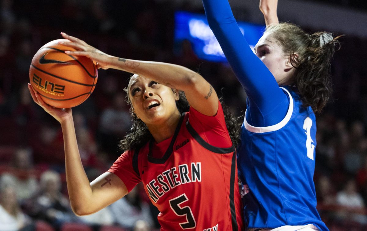 WKU forward Mya Pratcher (5) fights her way to the basket during the Lady Topper's game against the Middle Tennessee Lady Raiders in Bowling Green, Ky. on Saturday, Jan. 18, 2025.