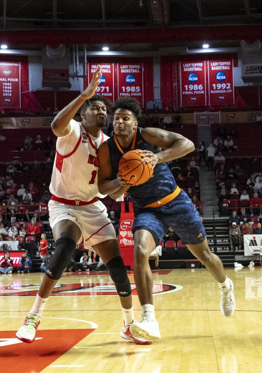 Western Kentucky Hilltoppers forward Blaise Keita (1) defends against UTEP Miners forward Otis Frazier III (23) during the Hilltoppers game against the UTEP Miners in Bowing Green, Ky. on Thursday, Jan. 30, 2025. 