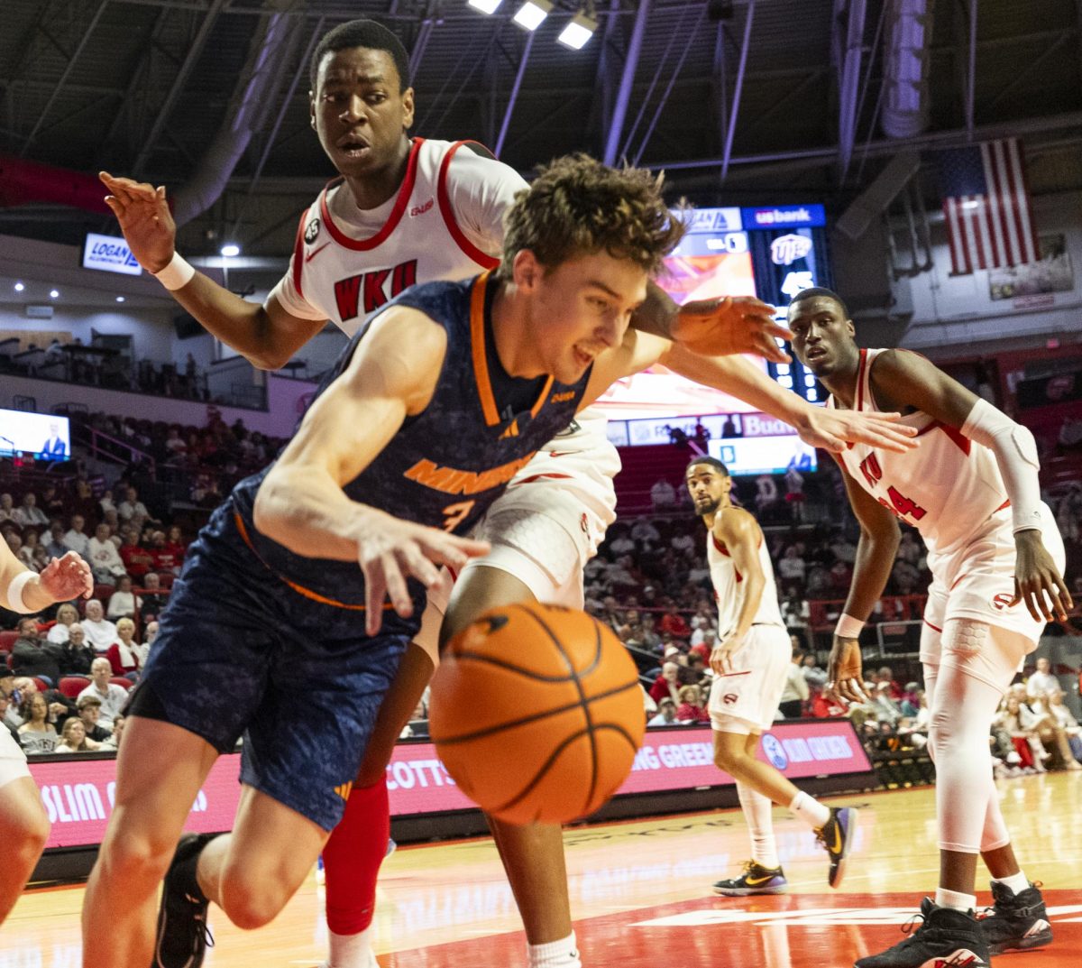 Western Kentucky Hilltoppers forward Leeroy Odiahi (21) defends against UTEP Miners guard Baylor Hebb (3) during the Hilltoppers game against the UTEP Miners in Bowing Green, Ky. on Thursday, Jan. 30, 2025. 