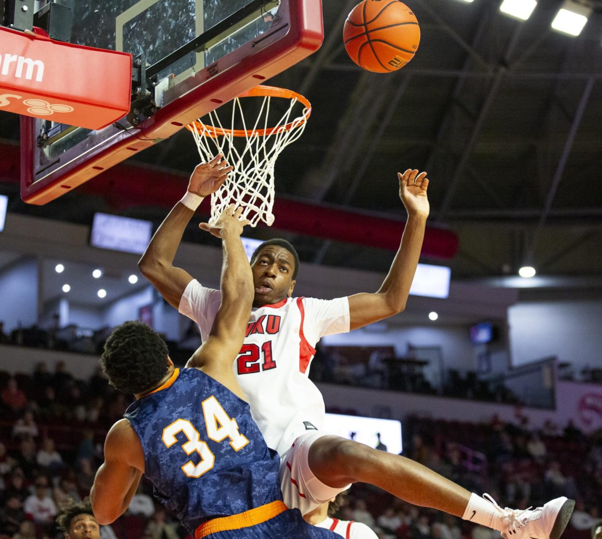 Western Kentucky Hilltoppers forward Leeroy Odiahi (21) takes a hit from UTEP Miners forward Kevin Kalu (34) during the Hilltoppers game against the UTEP Miners in Bowing Green, Ky. on Thursday, Jan. 30, 2025. 