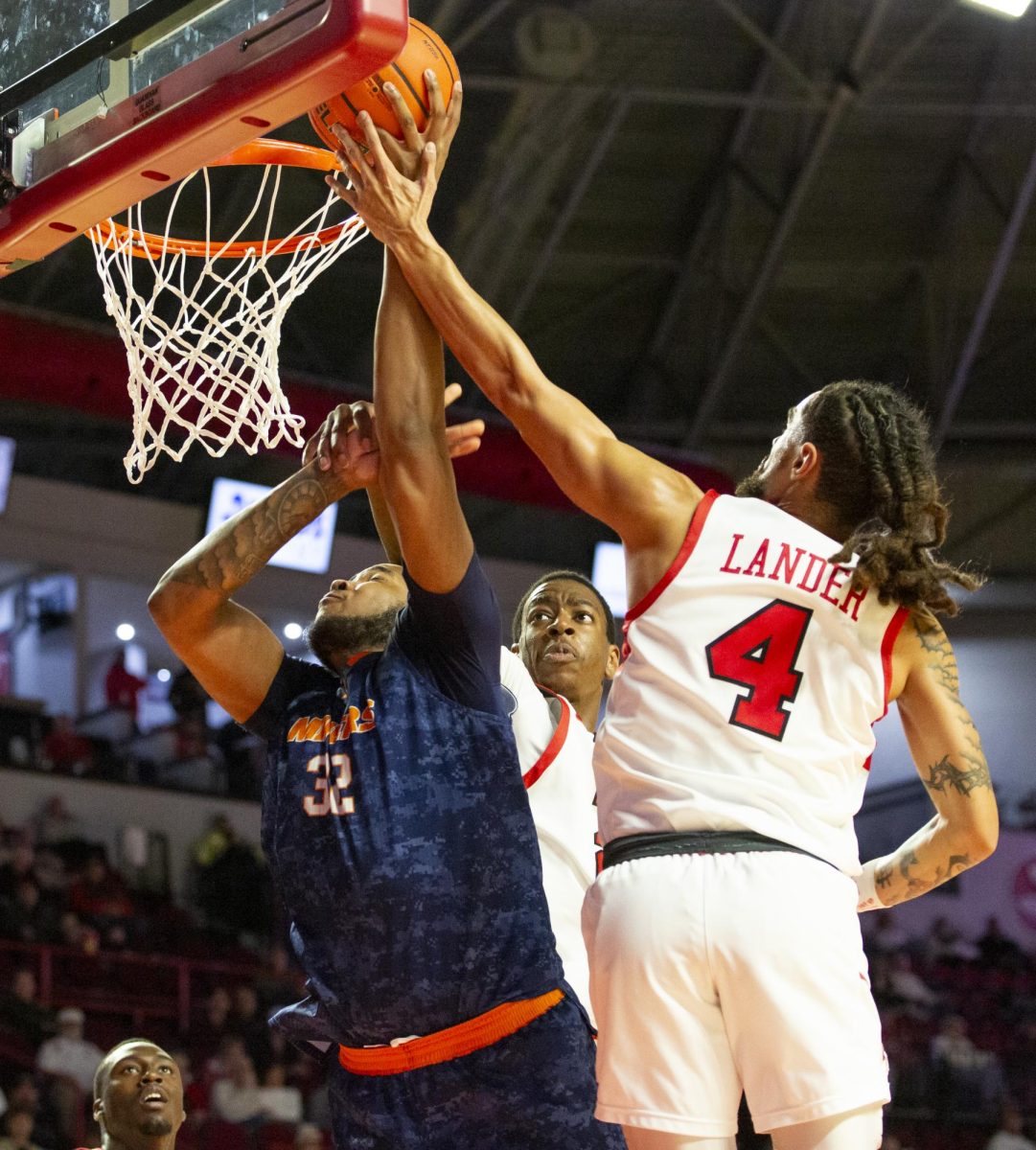 Western Kentucky Hilltoppers forward Leeroy Odiahi (21) and Western Kentucky Hilltoppers guard Khristian Lander (4) defend against UTEP Miners forward Derick Hamilton (32) during the Hilltoppers game against the UTEP Miners in Bowing Green, Ky. on Thursday, Jan. 30, 2025. 
