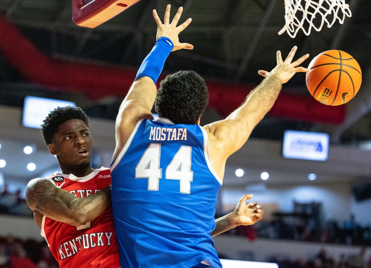 Western Kentucky Hilltoppers guard Don McHenry (2) passes the ball after attempting a layup during a game against Middle Tennessee State University in Diddle Arena on Saturday, Feb. 15, 2025. 