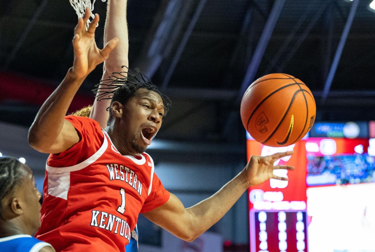 Western Kentucky Hilltoppers forward Blaise Keita (1) reaches to rebound the ball during a game against Middle Tennessee State University in Diddle Arena on Saturday, Feb. 15, 2025. 
