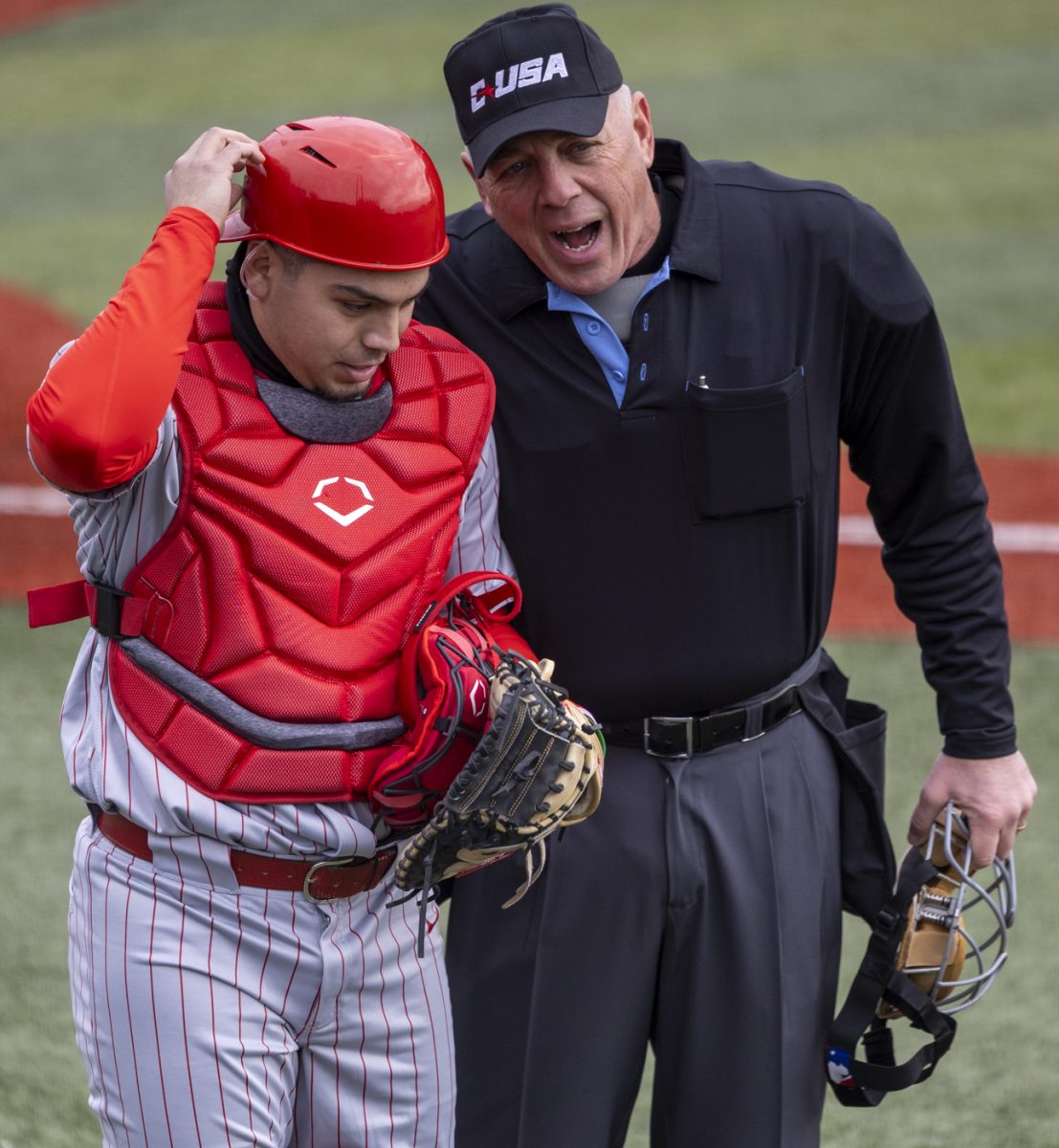 Illinois State University catcher Anthony Westbrook (4) listens to Conference USA Umpire Chris Deichman during a game against Western Kentucky University at Nick Denes Field on Feb. 14, 2025.