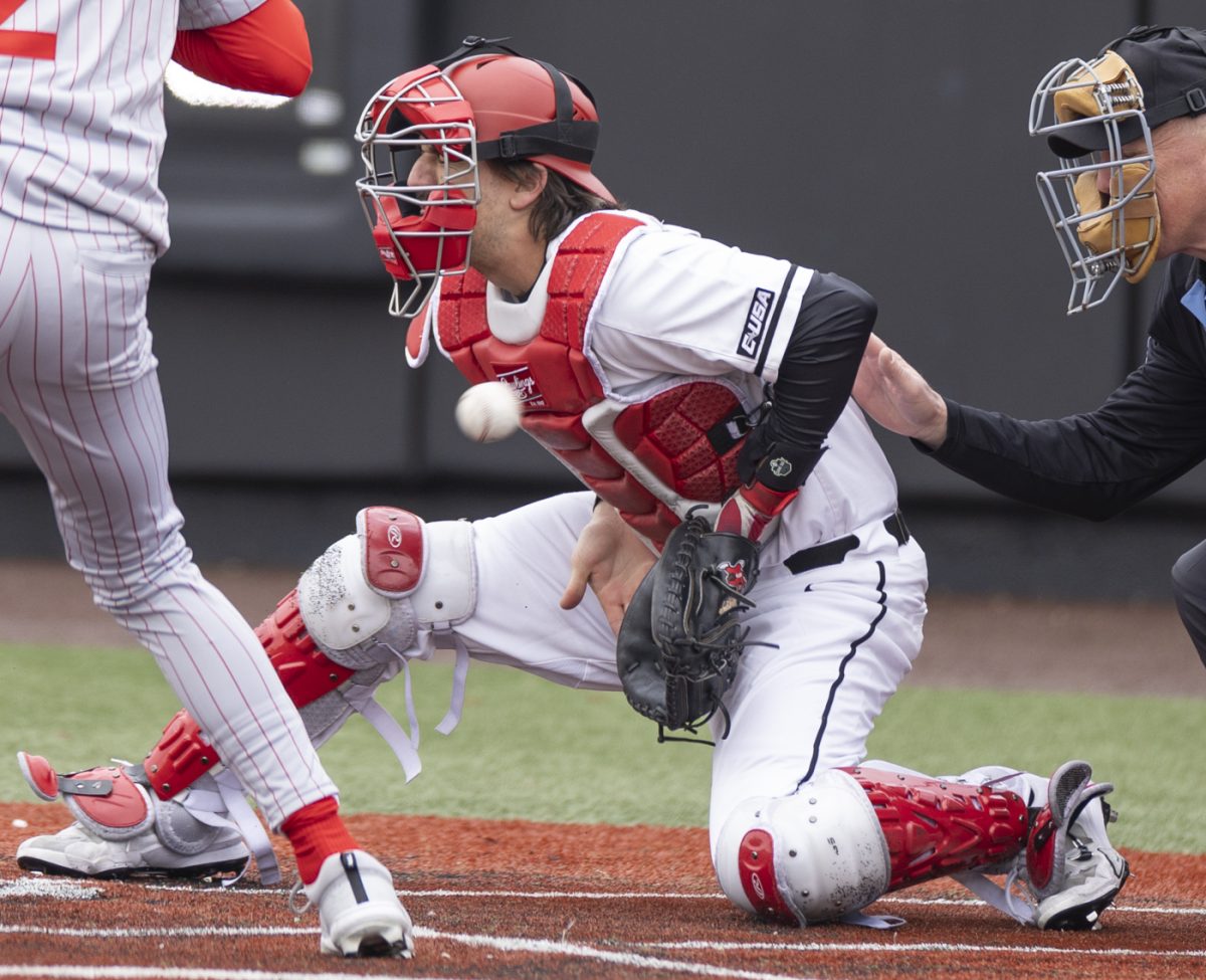Western Kentucky University Catcher Anthony Westbrook (4) drops to block a ball pitched at him during a game against Illinois State University at Nick Denes Field on Feb. 14, 2025.