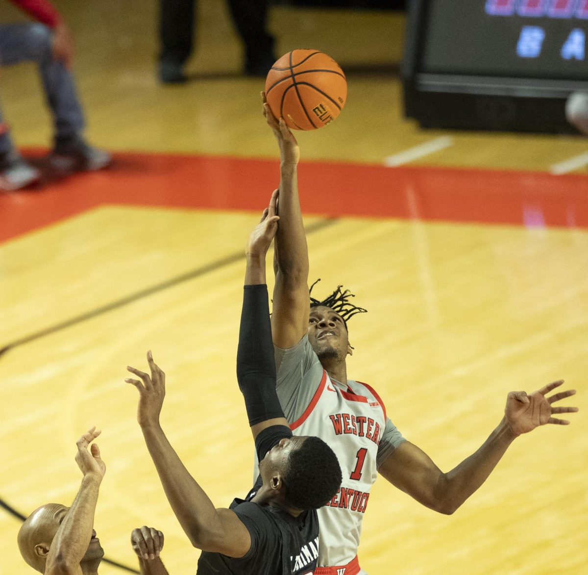 Western Kentucky Hilltoppers forward Blaise Keita (1) jumps for the ball on tipoff during a game against the New Mexico State Aggies in Diddle Arena on Saturday, Feb. 1  2025. 
