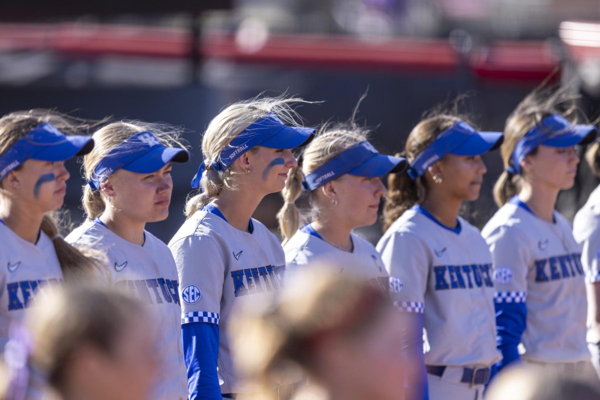 Players of University of Kentucky line up for the national anthem before the game at the WKU Softball Complex on Friday, Feb. 28, 2025 