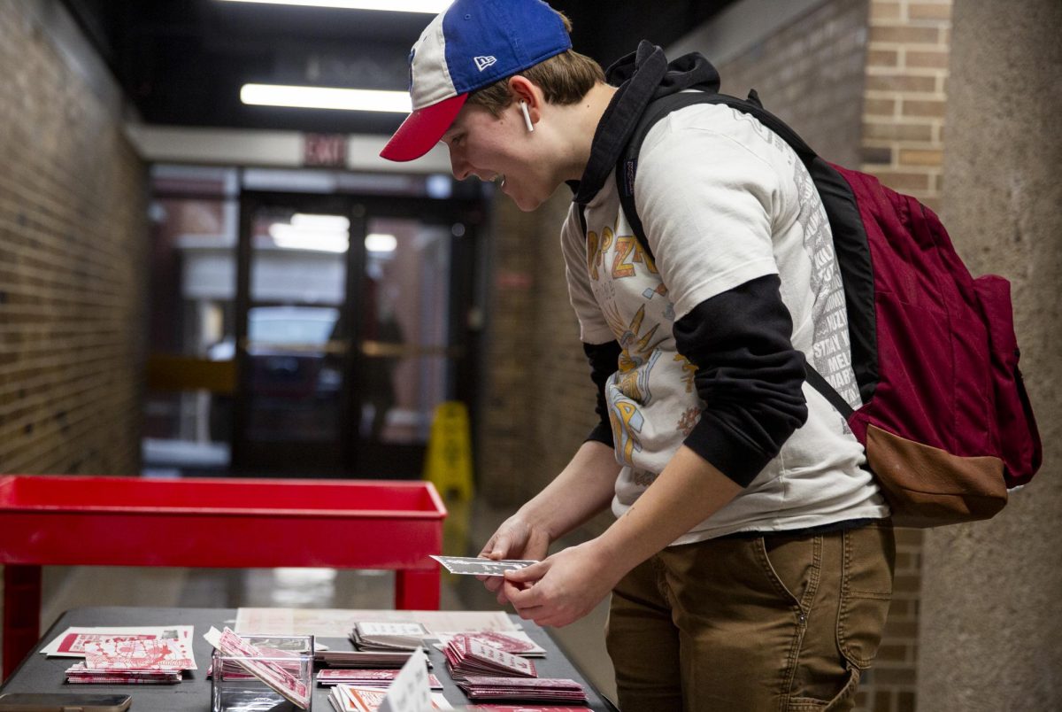 Elijah Powers, art education major, browses through the WKU Print Making Club’s student-made Valentine’s Day cards in FAC on Tuesday, Feb. 11, 2025. “I love when they do sales, whether it be the print making club or the ceramics club selling things.” Powers said. “I think it’s wonderful because it gives students a taste of if they want to do this outside of college. I think it’s great exposure and it’s a good way to spread art that’s made here.” 