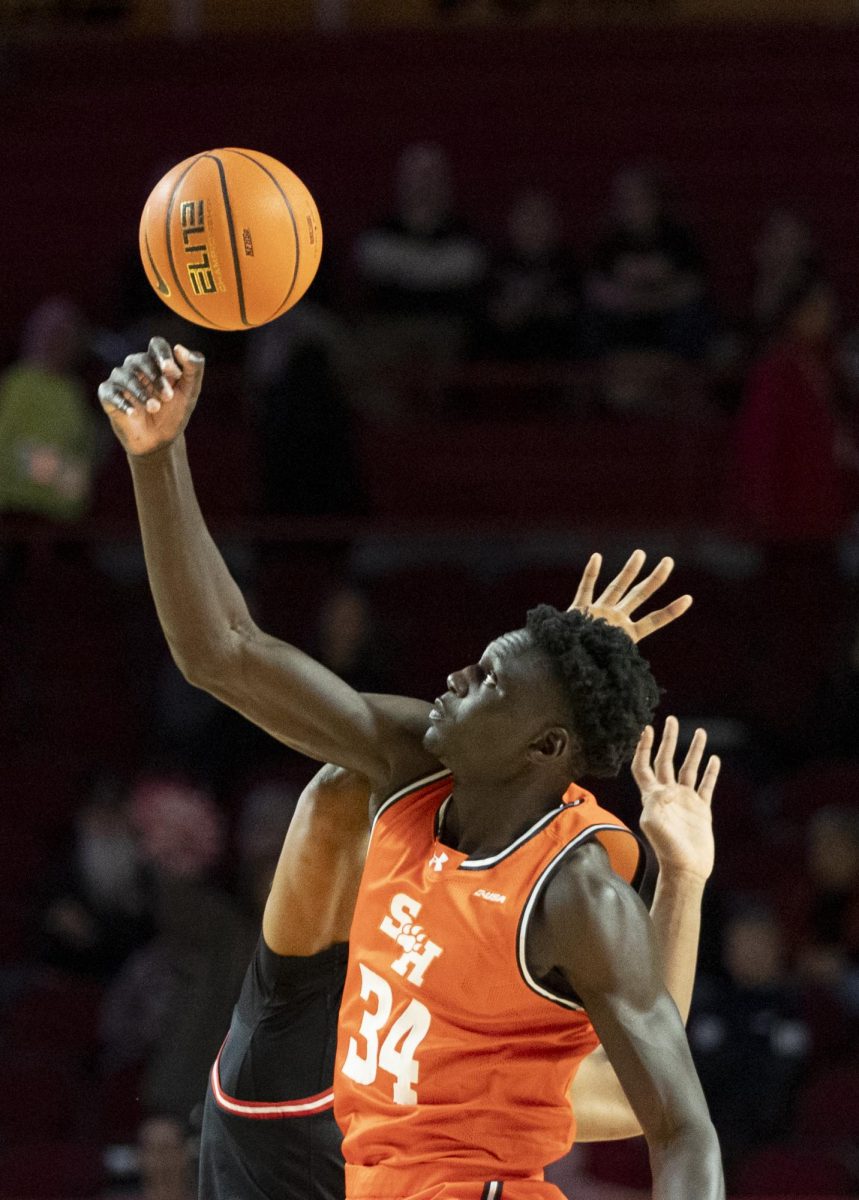 Sam Houston Bearkats forward Kalifa Sakho (34) goes for the tip off during the Hilltoppers game against the Sam Houston Bearkats in Bowling Green, Ky. On Friday, Feb. 21, 2025