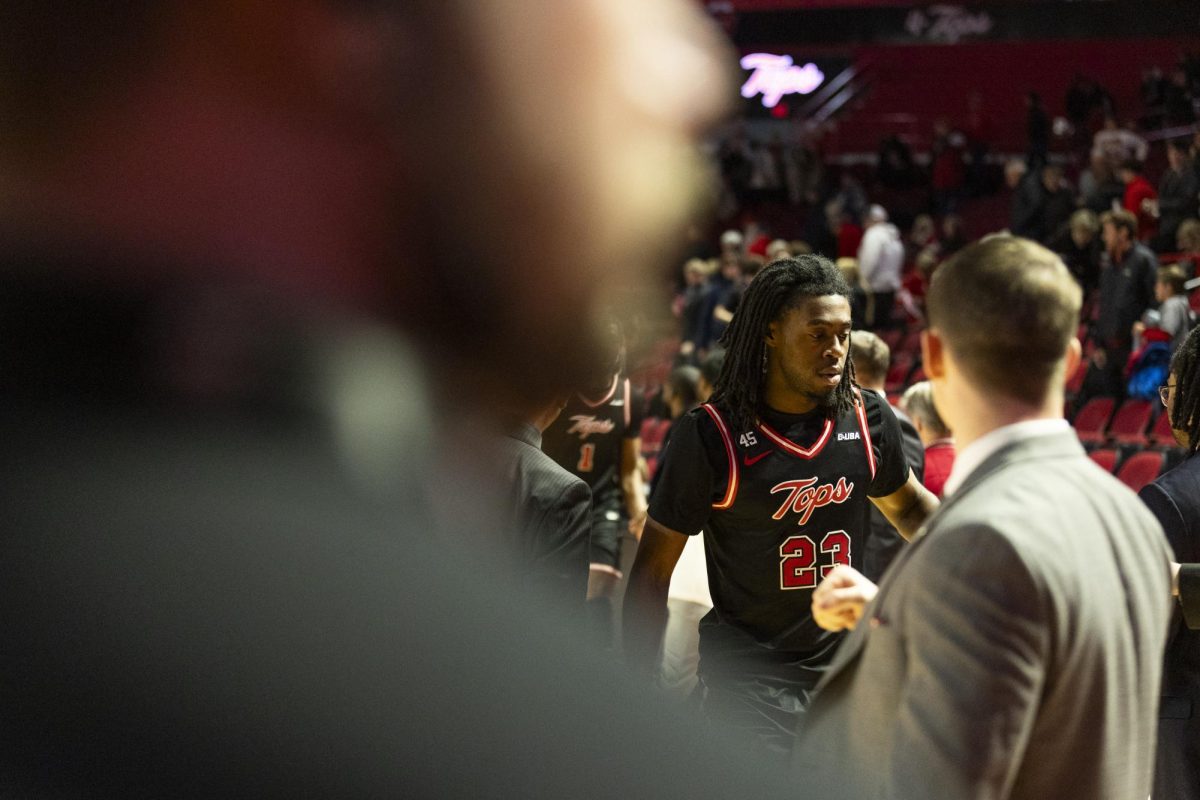 Western Kentucky Hilltoppers guard Enoch Kalambay (23) fists bumps coaches after the Hilltoppers game against the Sam Houston Bearkats in Bowling Green, Ky. On Friday, Feb. 21, 2025