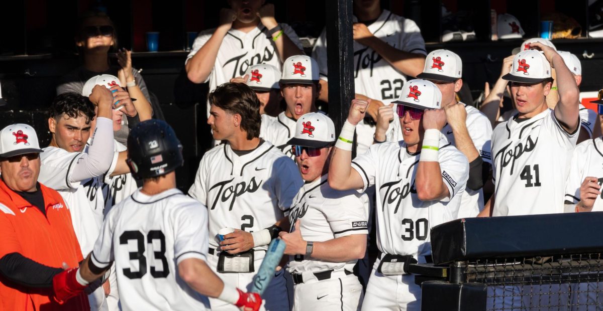 The Western Kentucky University dugout celebrates outfielder Ryan Wideman scored a run during a game against Southern Illinois University at Nick Denes Field  on Tuesday, March 11, 2025. 