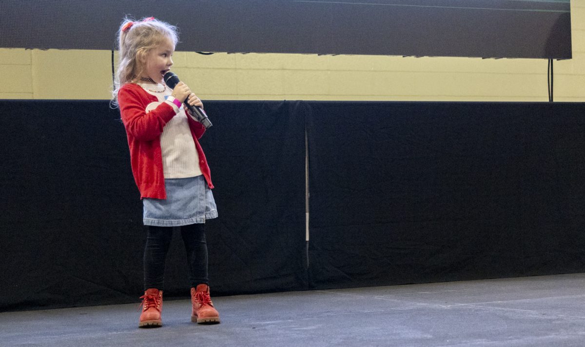 One of the Dance Big Red Children sings Defying Gravity from Wicked during the annual DBR event in Preston Center at Western Kentucky University to raise money for Norton Children’s Hospital on March 7, 2025.