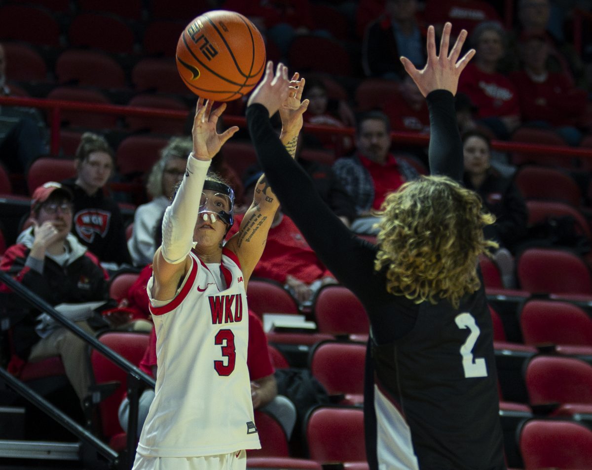 Western Kentucky Lady Toppers guard Alexis Mead (3) attempts a three-point field goal over New Mexico State Aggie guard Loes Rozing during the Lady Toppers basketball game vs. the New Mexico State University Aggies at E.A. Diddle Arena on March, 1, 2025. WKU won 85-68.