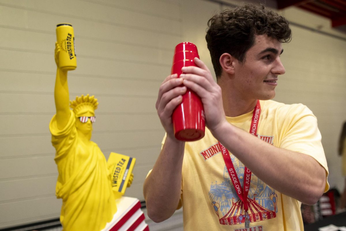 Event coordinator Gabe Jerbon shuffles the raffle tickets for the long awaited raffle of the “Statue of LiberTWEA” during the “Midnight on the Hill” fundraising event for St. Jude Children’s Research Hospital in the Preston Fitness Center on Saturday, April 5, 2025. 