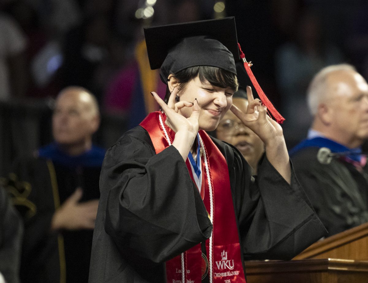 A potter College of Arts and Letters Graduate signs the National Anthem during the PCAL recognition ceremony on Friday, May 9, 2025.