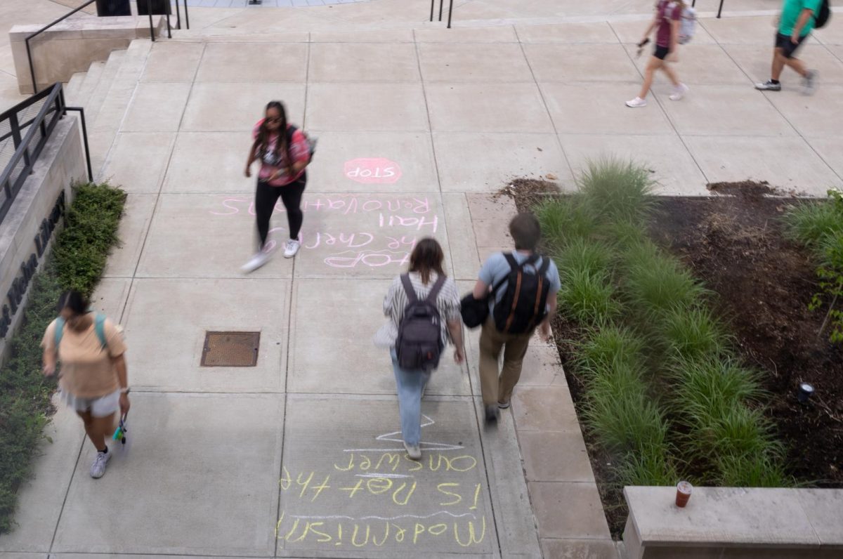 The morning after WKU unveils their plans for renovations at Cherry Hall on WKU’s campus, individuals voice their opinions at the entrances of The Commons at Helm Library on Friday, May 2, 2025. “It’s kind of stupid” says Sage Parker. “We have buildings on campus that don’t have elevators.”